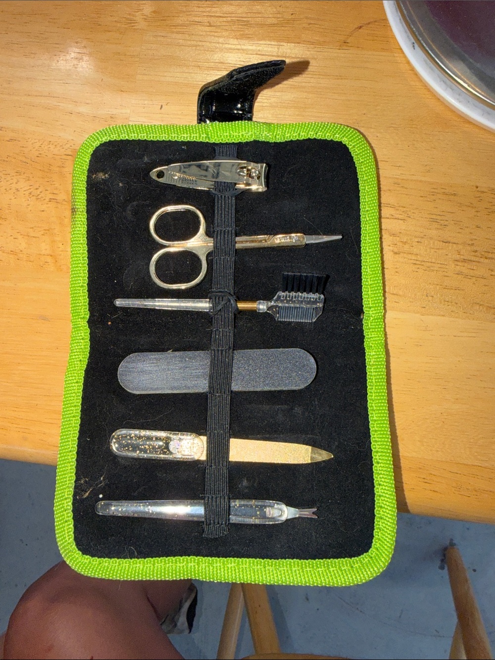 6-piece manicure and grooming set features a compact folding black pouch with a